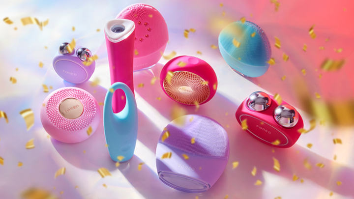 Colorful FOREO facial devices in a festive setting